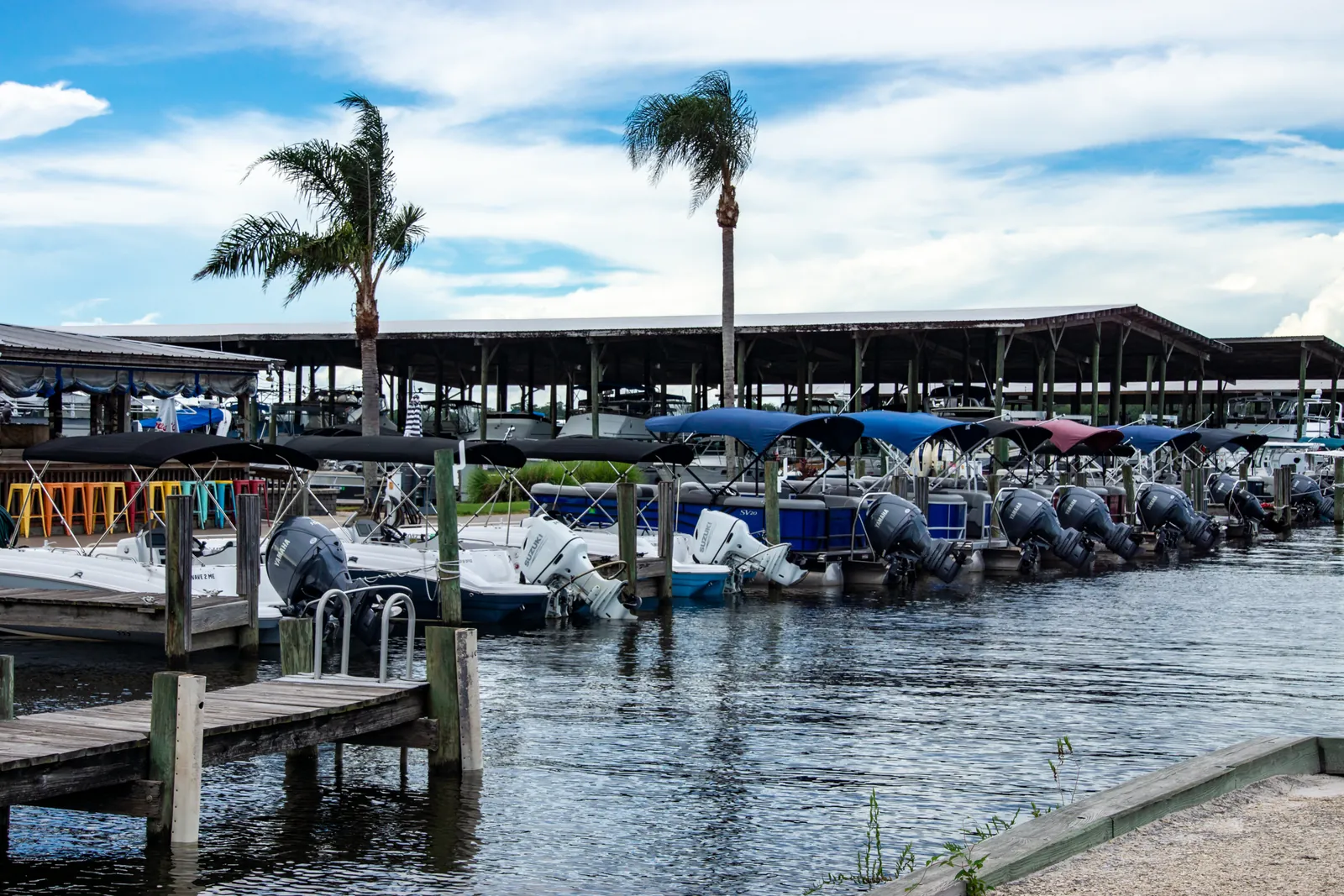 Boats docked under covered slips at Doctors Lake Marina, Clay County
